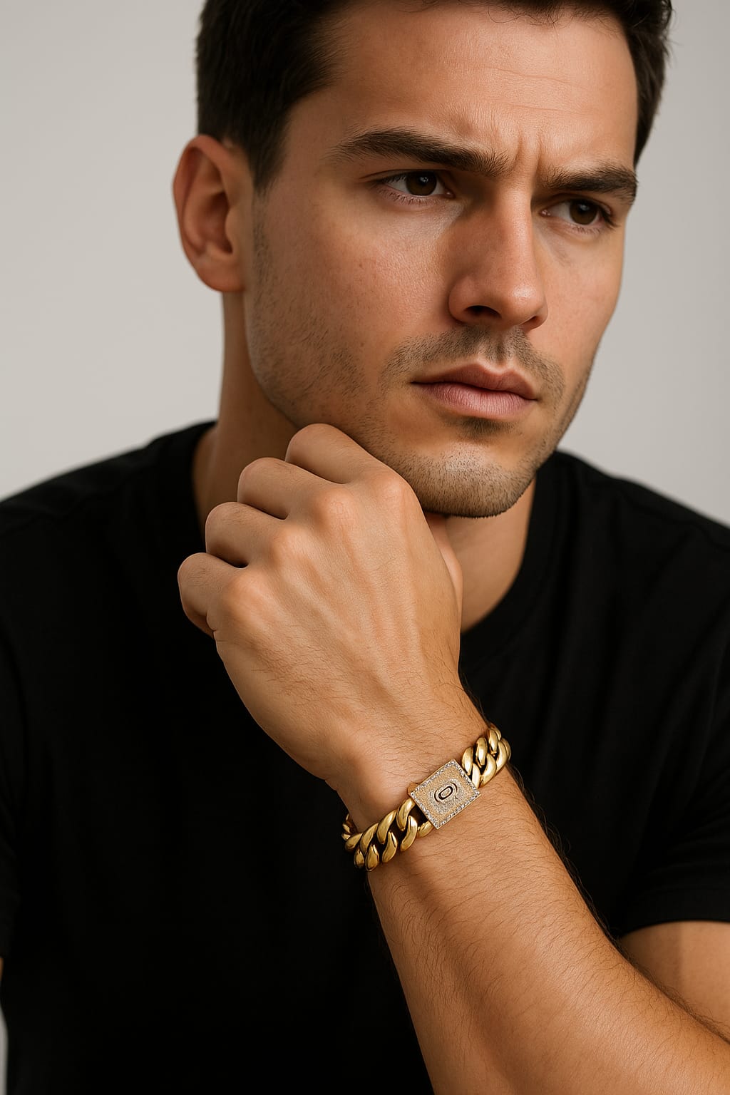 Man wearing a gold bracelet with a clear background