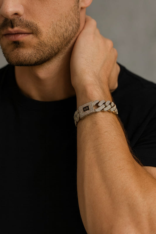 Man wearing a silver bracelet on his wrist with a blurred background